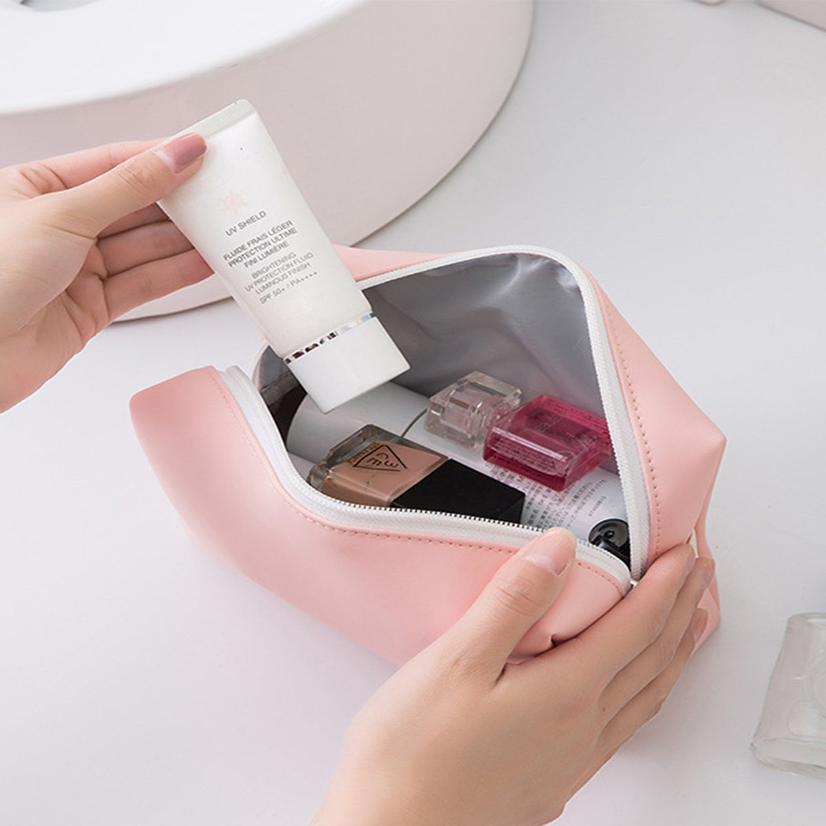 pink custom makeup bag with products being used