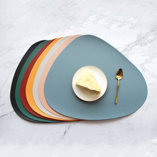 Colourful oval leather look placemats
