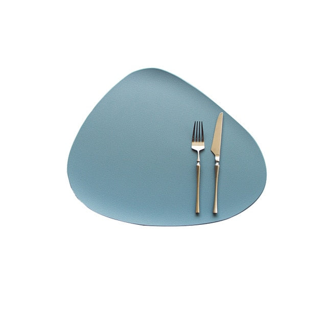 Blue leather look placemat with knife and fork