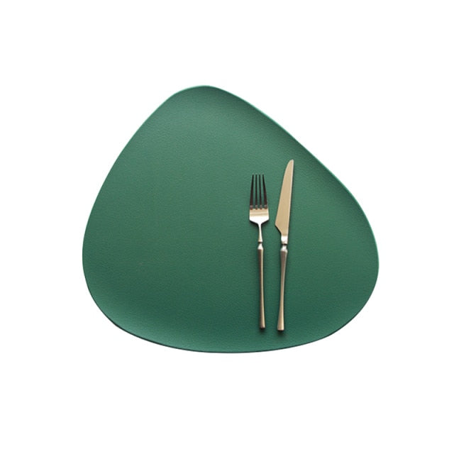 Green leather look placemat with knife and fork