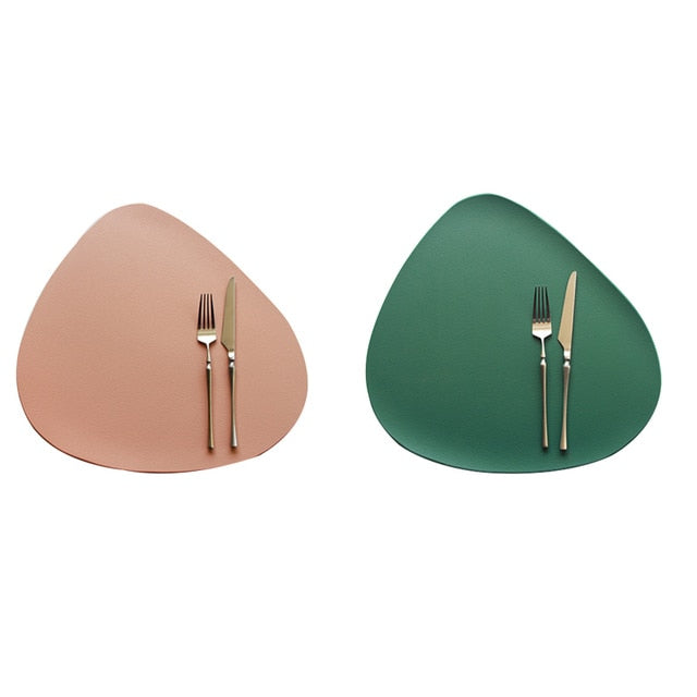 Beige and green leather look placemat with knife and fork