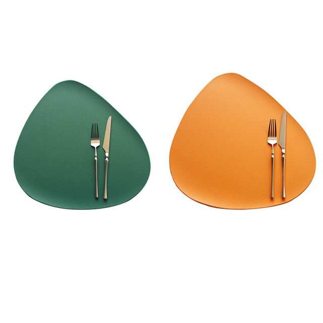 Orange and green leather look placemat with knife and fork