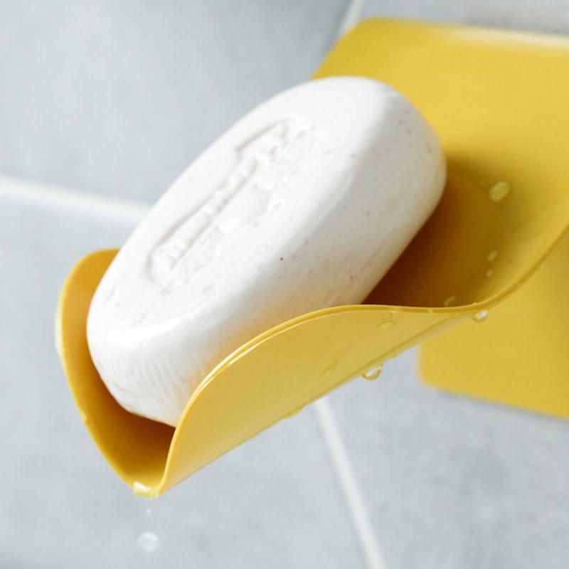 Yellow soap dish with bar of soap