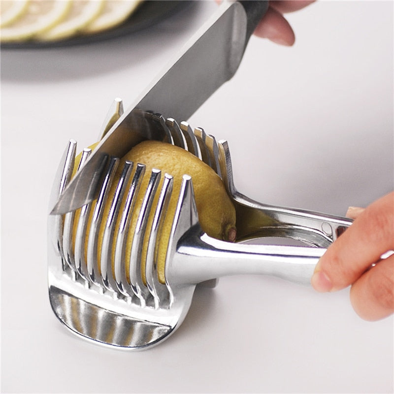 Stainless steel vegetable slicer slicing a lemon