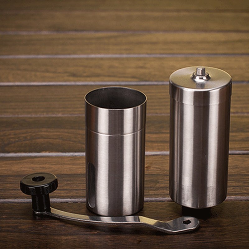 Manual coffee grinder separated into parts