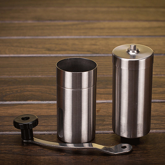Manual coffee grinder separated into parts